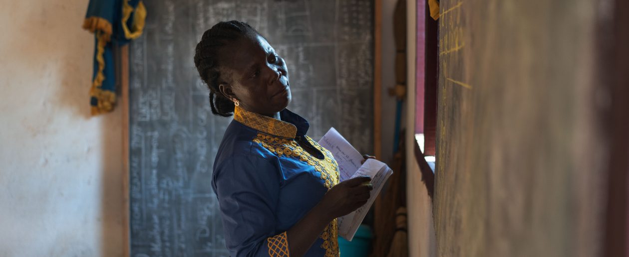 Literacy instructor Damaris Sarape (Center) holding a literacy class in Bozoum, Central African Republic